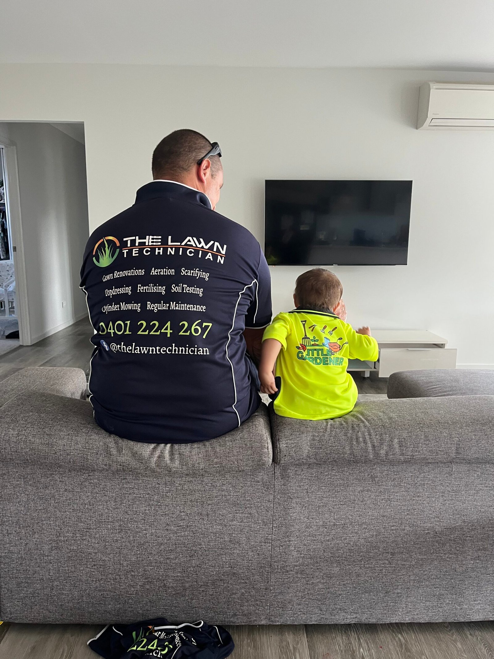 The family behind The Lawn Technician looking across a completed lawn project