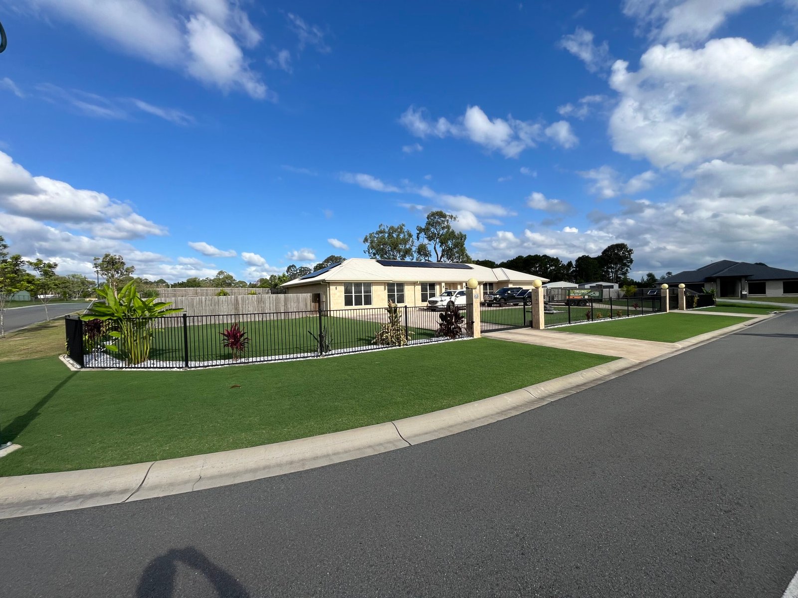 A neatly maintained residential lawn serviced by The Lawn Technician